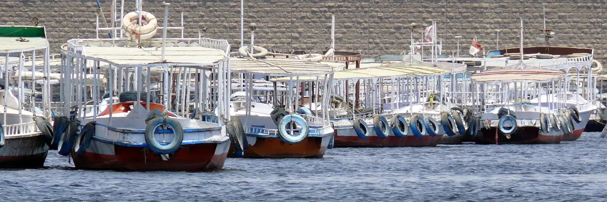 Moored motorboats waiting at the departure point for Philae